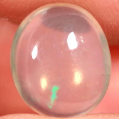 SOLID CRYSTAL OPAL Transparent with green and purple moving within